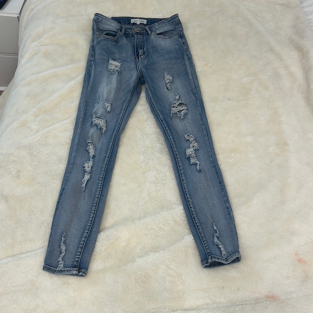 slightly worn ripped jeans